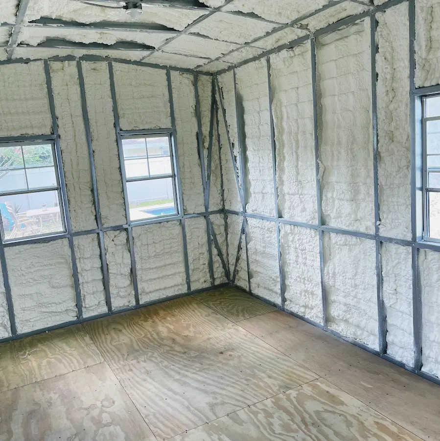 Closed-cell spray foam insulation applied to wall cavities in a residential project in Monona